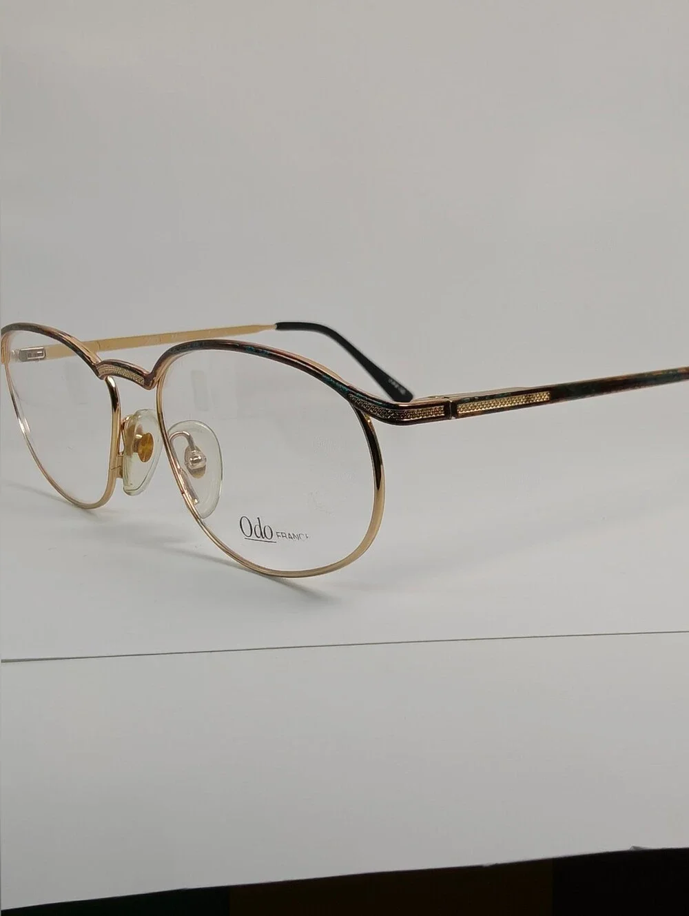 Manola Odo Frames Round Gold-Tone. Glasses with Subtle Copper Weathered Patina.
